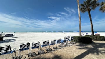 On the beach, sun loungers, beach towels