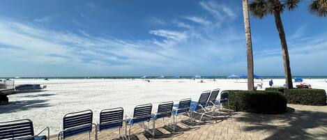 On the beach, sun loungers, beach towels