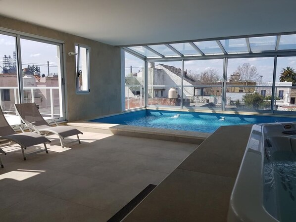 Indoor pool, open 9:00 AM to 10:00 PM, pool loungers