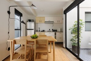 Fridge, microwave, stovetop, coffee/tea maker