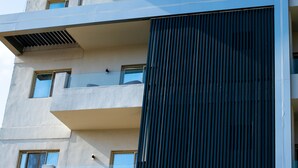 A hotel named 'Pyramids Oasis' with a modern architectural design, featuring balconies and large windows. - Pyramids Chill Out (Giza)