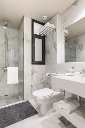 Deluxe Apartment, 2 Bedrooms | Bathroom | Shower, rainfall showerhead, free toiletries, slippers