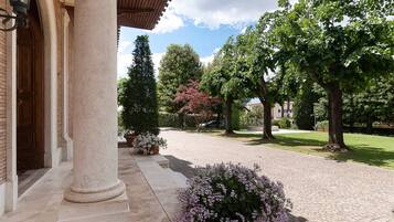 Experience a serene retreat amidst lush gardens and classical architecture.
