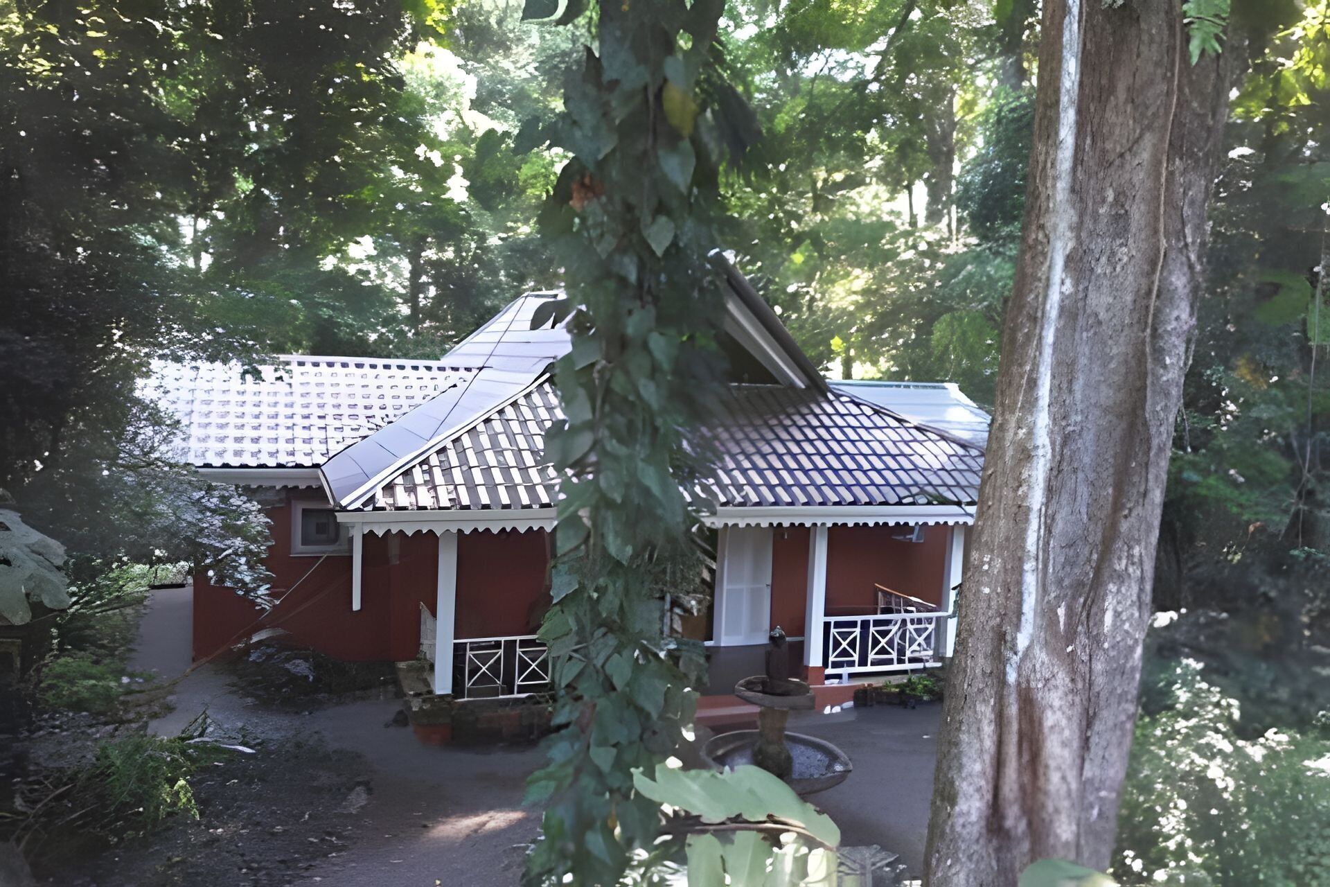 A traditional building with a tiled roof and a small porch.