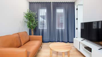 LV202 - One-bedroom apartment | Living area | 50-inch flat-screen TV with digital channels