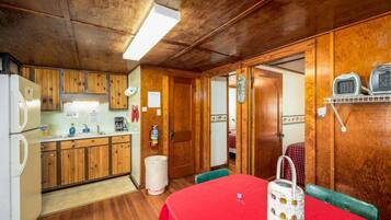 Fridge, microwave, coffee/tea maker, cookware/dishes/utensils