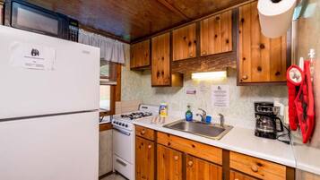 Fridge, microwave, coffee/tea maker, cookware/dishes/utensils