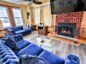 Smart TV, fireplace, table football, books