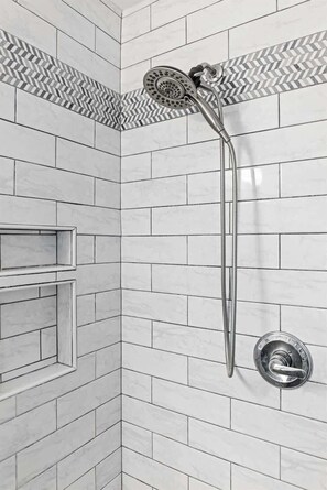 Shower, hair dryer, towels, shampoo