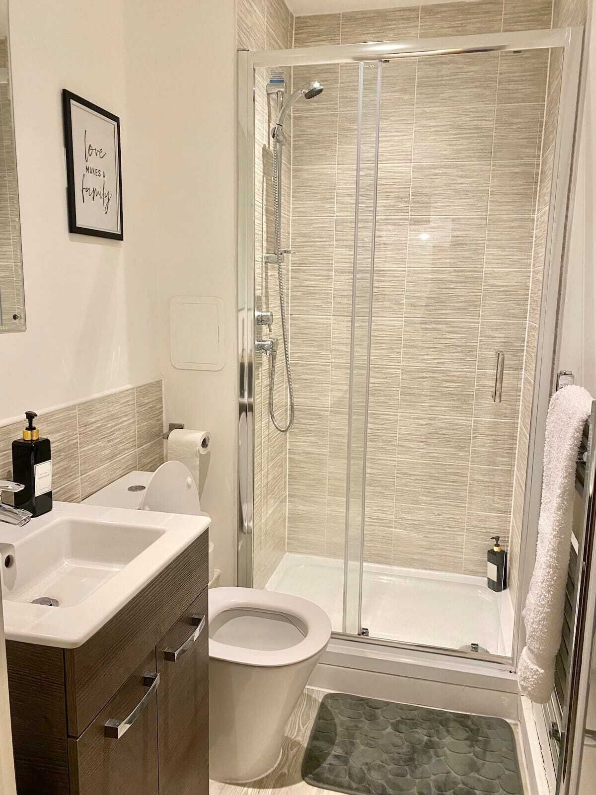 Shower, hair dryer, towels, soap