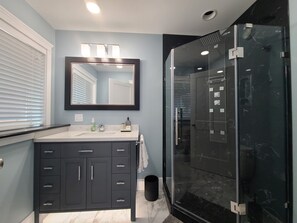 Shower, hair dryer, towels, soap