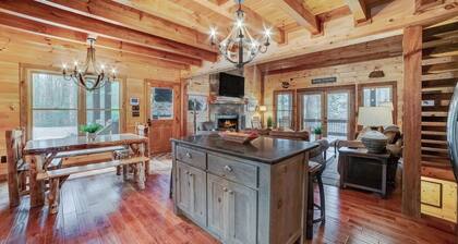 Charming Riverfront Cabin for 14 – Hot Tub, Game Room & Outdoor Fireplace!