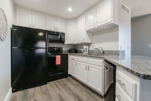 Coffee/tea maker, fridge, microwave, oven