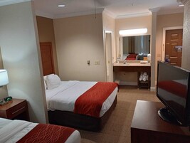 Deluxe Room, Multiple Beds | In-room safe, desk, blackout drapes, iron/ironing board
