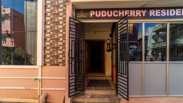A building entrance with a sign reading "PUDUCHERRY RESIDENCE". - Puducherry Residency (Puducherry)