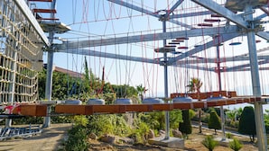 A metal framework with ropes and wooden planks, likely part of a climbing structure or obstacle course. - Royal Teos Thermal Resort Clinic & Spa - Halal Hotel (Seferihisar)