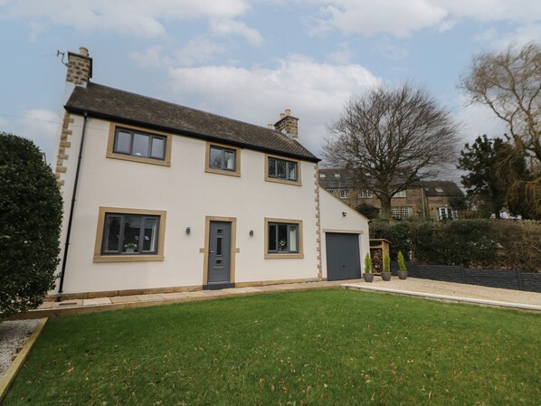 A two-story house with a front door, two windows on the ground floor, and a garage door. - Eboracum (Hope Valley)