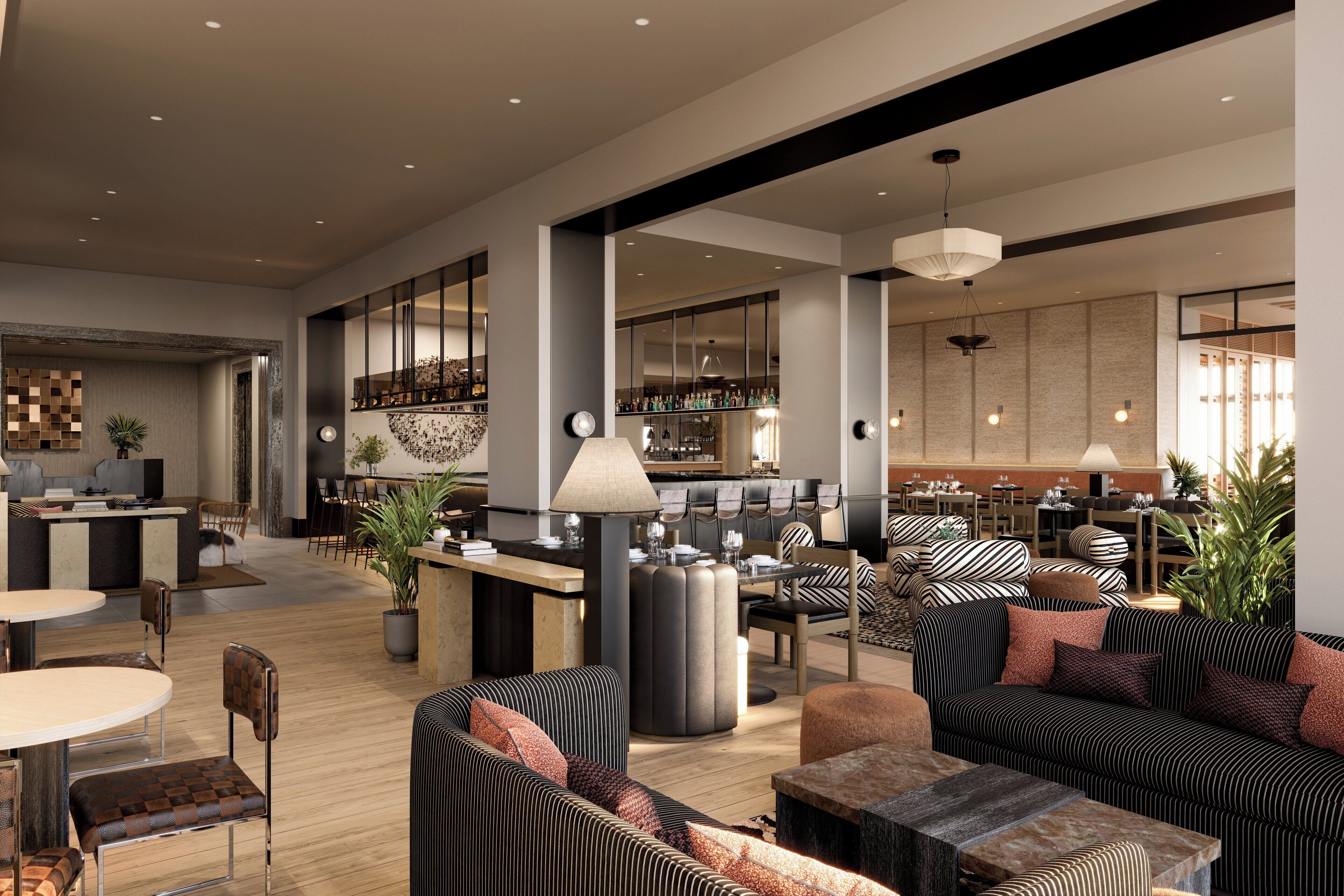 A spacious lobby with a bar area, seating arrangements, and a reception desk.