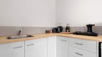 Fridge, microwave, stovetop, coffee/tea maker