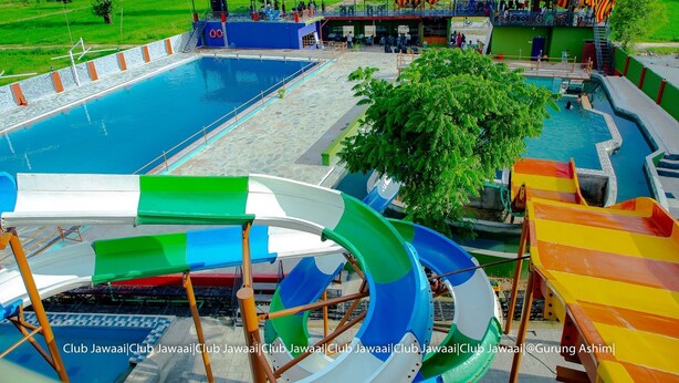 A water park with multiple slides and a large pool. - Club Jawai (Butwal)