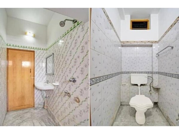 Een douche, een regendouche, gratis toiletartikelen, handdoeken