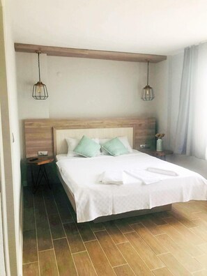 ห้องดีลักซ์, วิวสวน | Wi-Fi ฟรี, ผ้าปูที่นอน