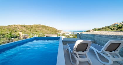 Modern Condo In Walking Distance to Surf Beach