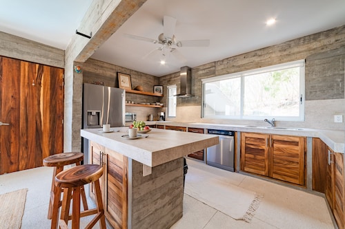 Modern Condo In Walking Distance to Surf Beach