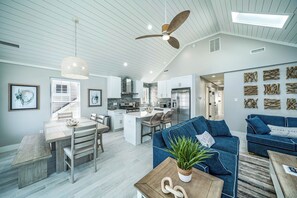 A modern kitchen with white cabinets, a central island, and a ceiling fan. - Beach Block In OCNJ between 7th & 8th St! - 3 Bd/2 Bath, Sleeps 10 (Ocean City)