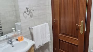 Shower, towels, soap, shampoo