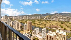 A cityscape with high-rise buildings, a river, and green spaces. - Ocean View Waikiki Condo with Free Parking -- Short Walk to Beach (Honolulu)