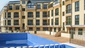 A multi-story residential building with a swimming pool. - Amazing home in Ortigueira with WiFi (Ortigueira)