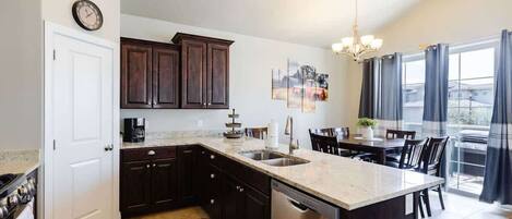 Coffee/tea maker, fridge, microwave, oven