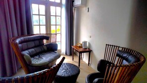 Executive Penthouse | Living area | 55-inch flat-screen TV with cable channels, DVD player - Yatu Lau Lagoon Resort (Pacific Harbour)