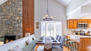 A modern kitchen with wooden cabinets, a built-in oven, and a microwave. - Chetola Chestnut 8 - close to downtown Blowing Rock! (Blowing Rock)