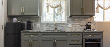 Fridge, microwave, stovetop, coffee/tea maker