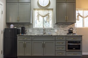 Fridge, microwave, stovetop, coffee/tea maker