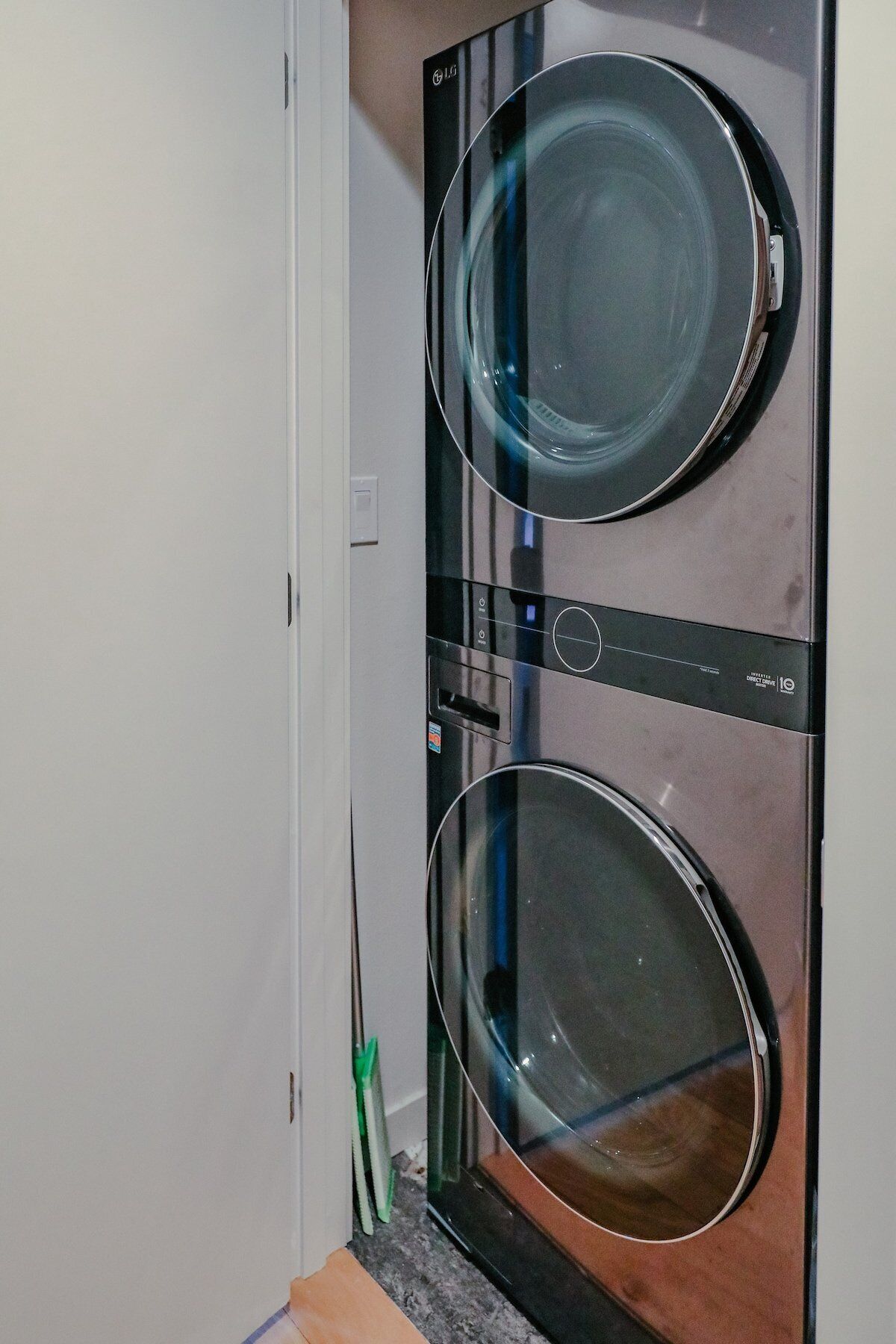 A front view of a washing machine with a control panel and a door.