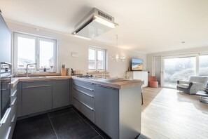 Fridge, stovetop, dishwasher, coffee/tea maker