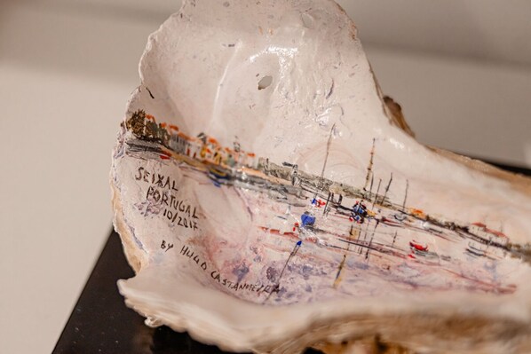 A sculpture with inscriptions and abstract elements.