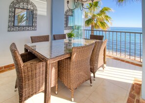 Outdoor dining - Fabulous beachfront Penthouse at La Perla De La Bahia (Casares)