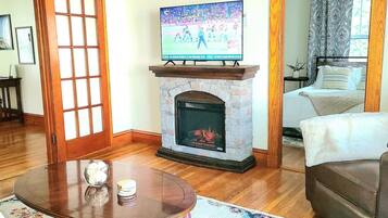 TV, fireplace, books