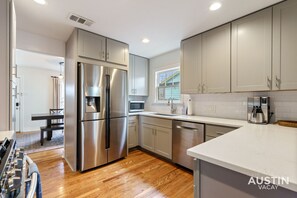 Fridge, microwave, oven, stovetop - Elegant Escape | Gourmet Kitchen + Outdoor Living (Austin)