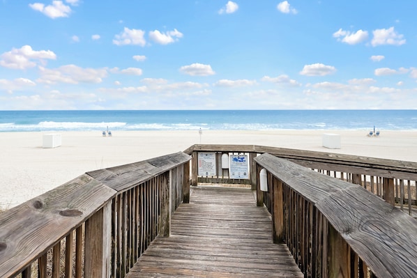 A wooden boardwalk leading to a beach with a clear sky. - Ground Floor Unit, Seaside Beach and Racquet Club - Signature Properties (Orange Beach)