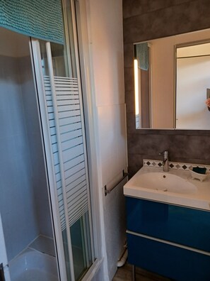 Shower, hair dryer, soap, shampoo