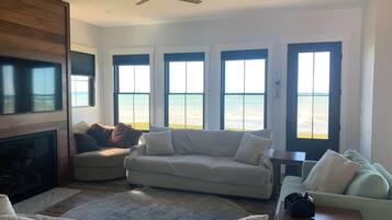 Smart TV, fireplace, books, printers