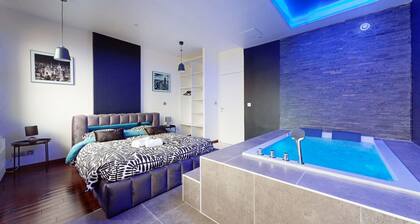 Charmant appartement au coeur des gratte ciel avec Jacuzzi