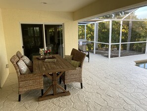 Outdoor dining - The Island House on Pine Island
with heat-pump heated most privacy pool (Bokeelia)