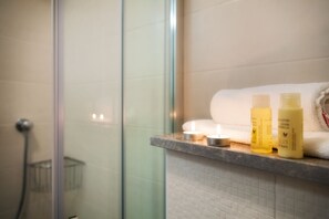 Shower, hair dryer, towels, soap
