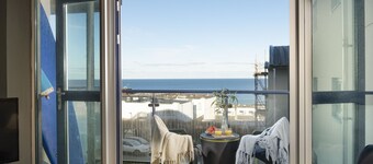 Bathsheba, Ocean 1 -  This modern 3-bedroom apartment with sea views sits right above Fistral Beach